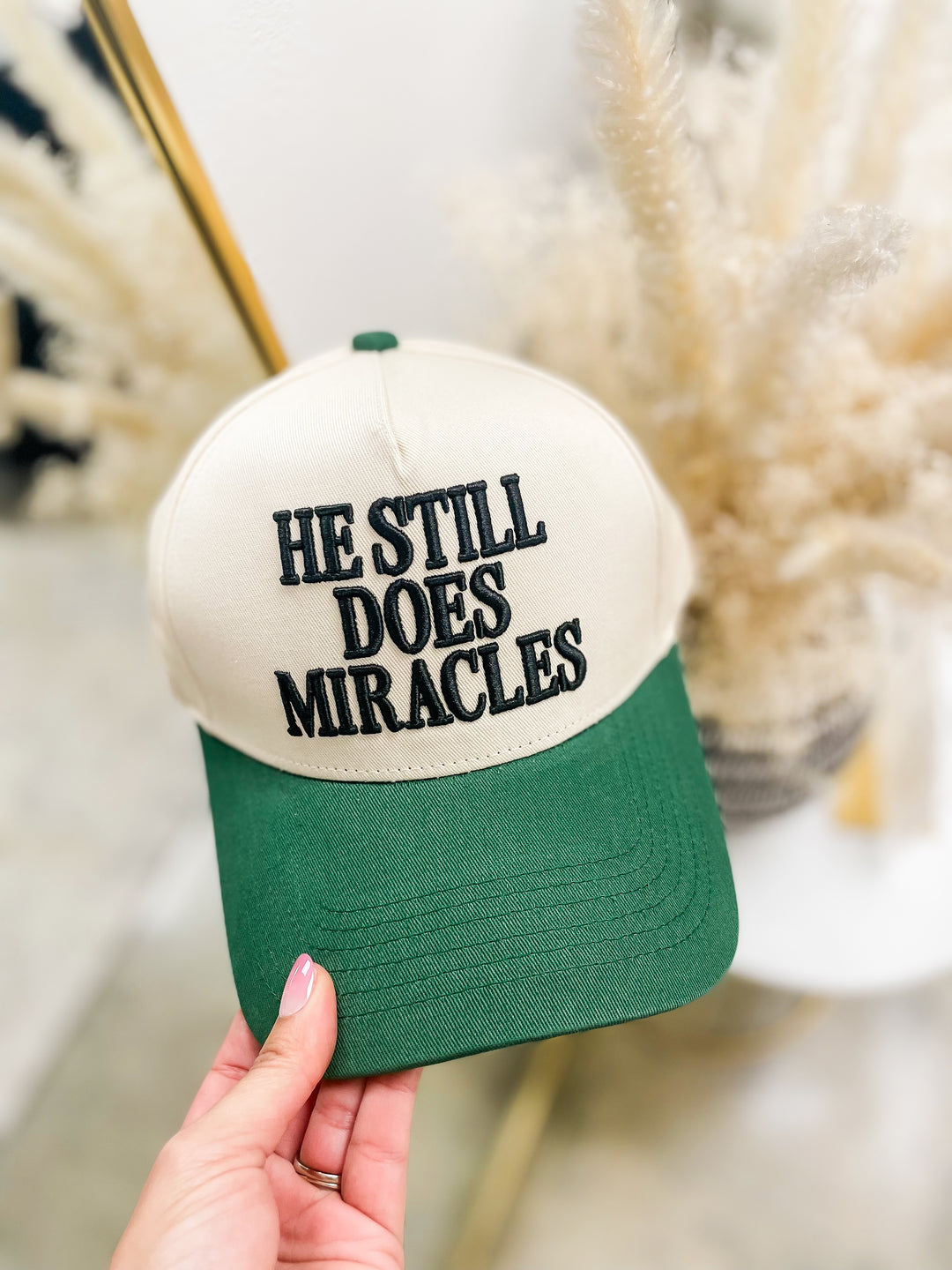 He Still Does Miracles Trucker Hat